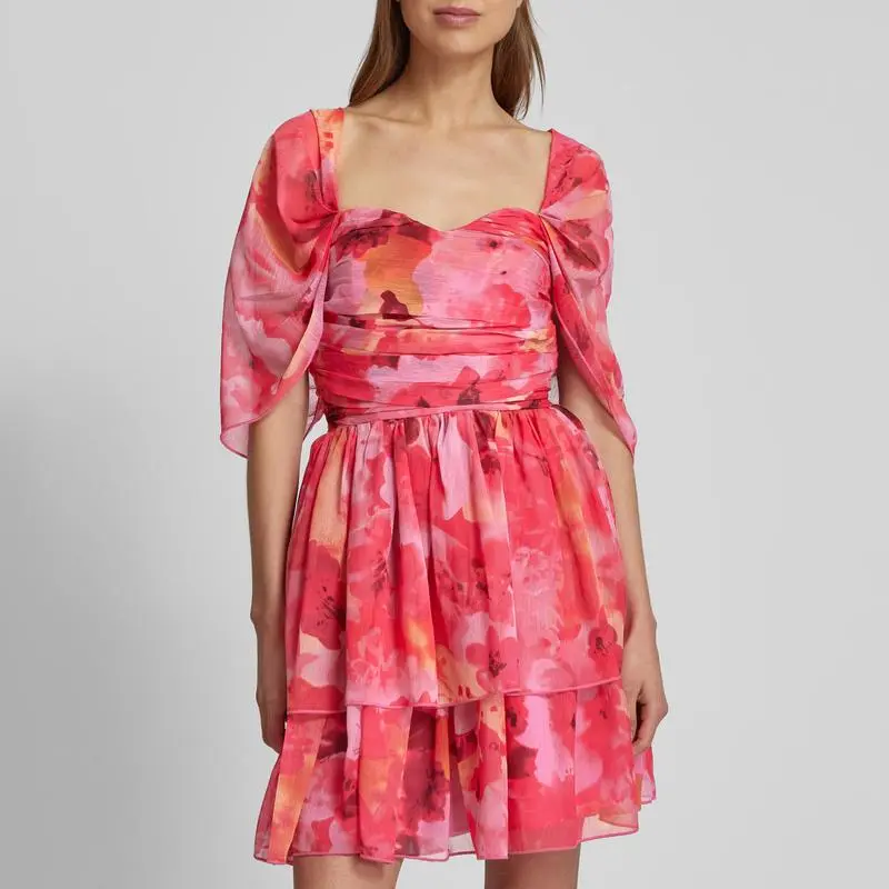 Custom cocktail dress with ruffle trim in bright pink